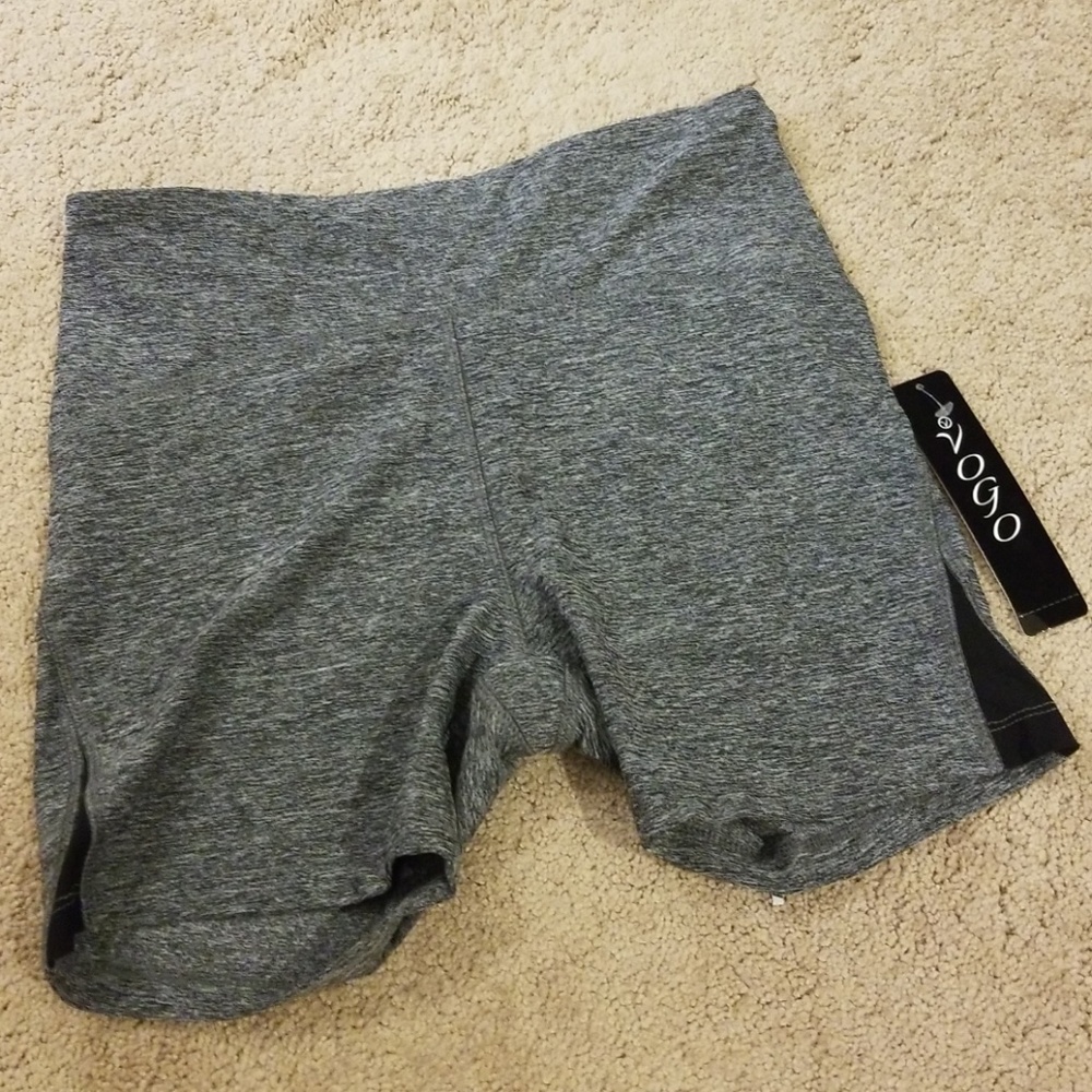 Gray athletic shorts with black mesh slits